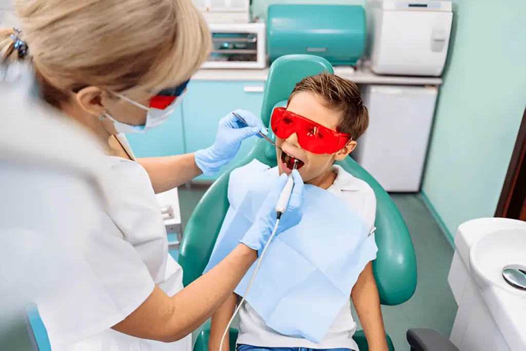 A dentist examining a boy.