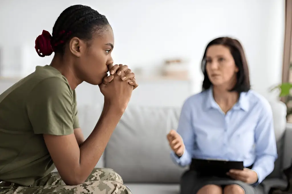 Female soldier receiving mental health counseling.