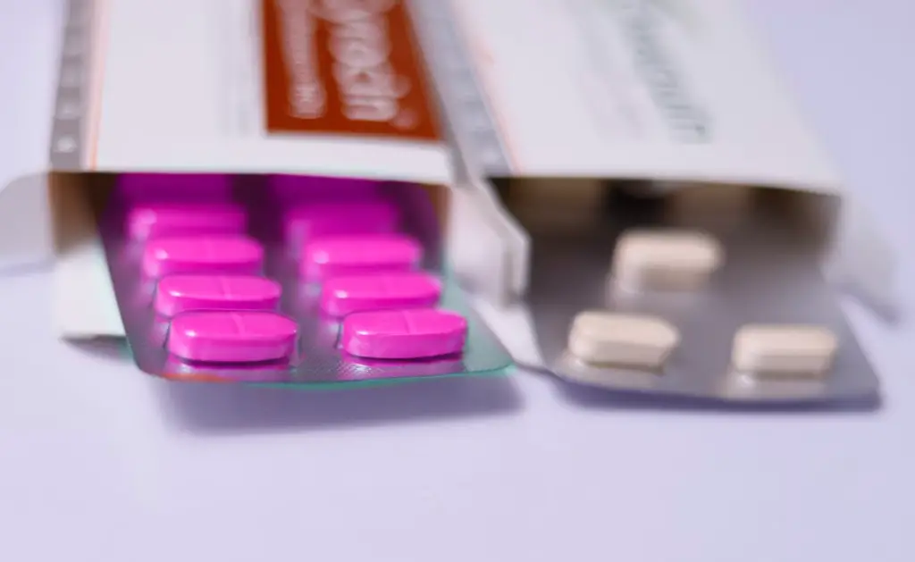 Pink and white pills in packaging