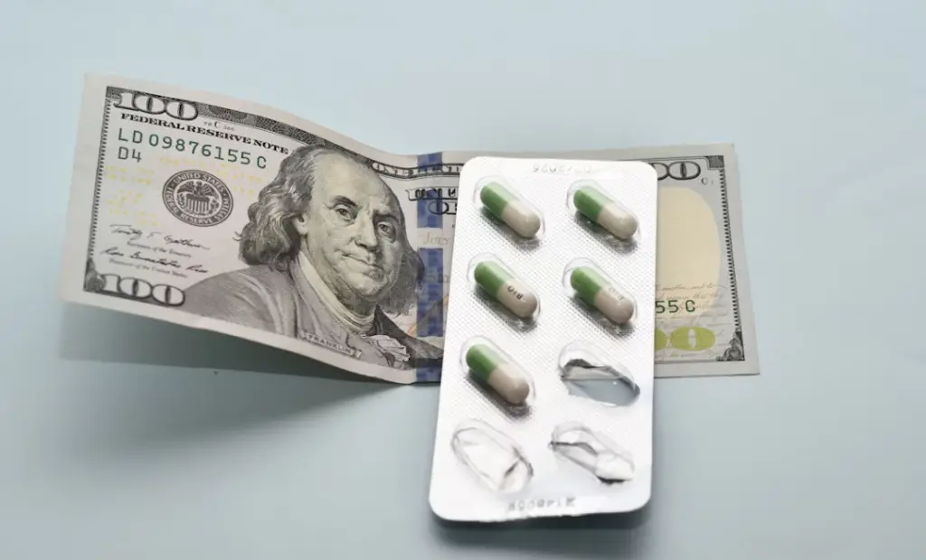 Blister pack resting on money