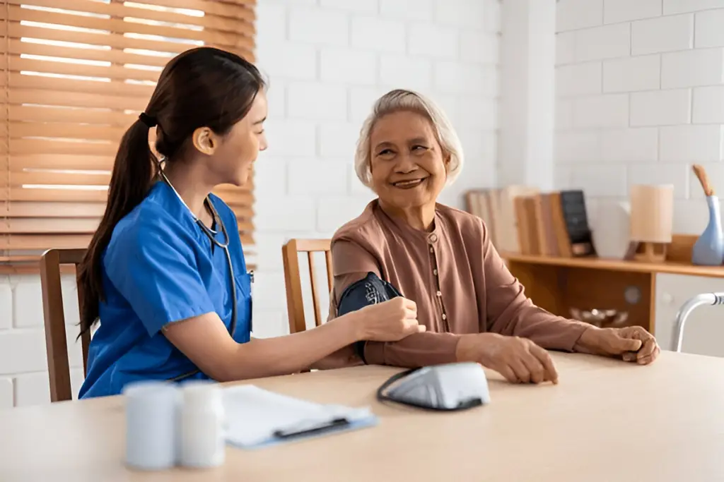 Nurse takes senior blood pressure.