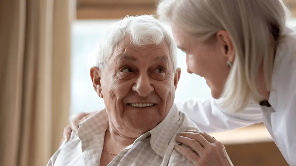 Smiling senior couple embrace.