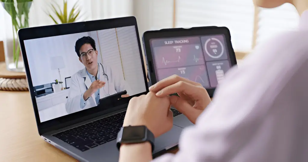 Telehealth visit, doctor reviews data.