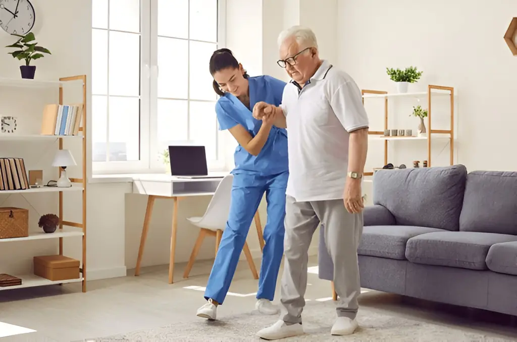 Nurse helps elderly man walk.