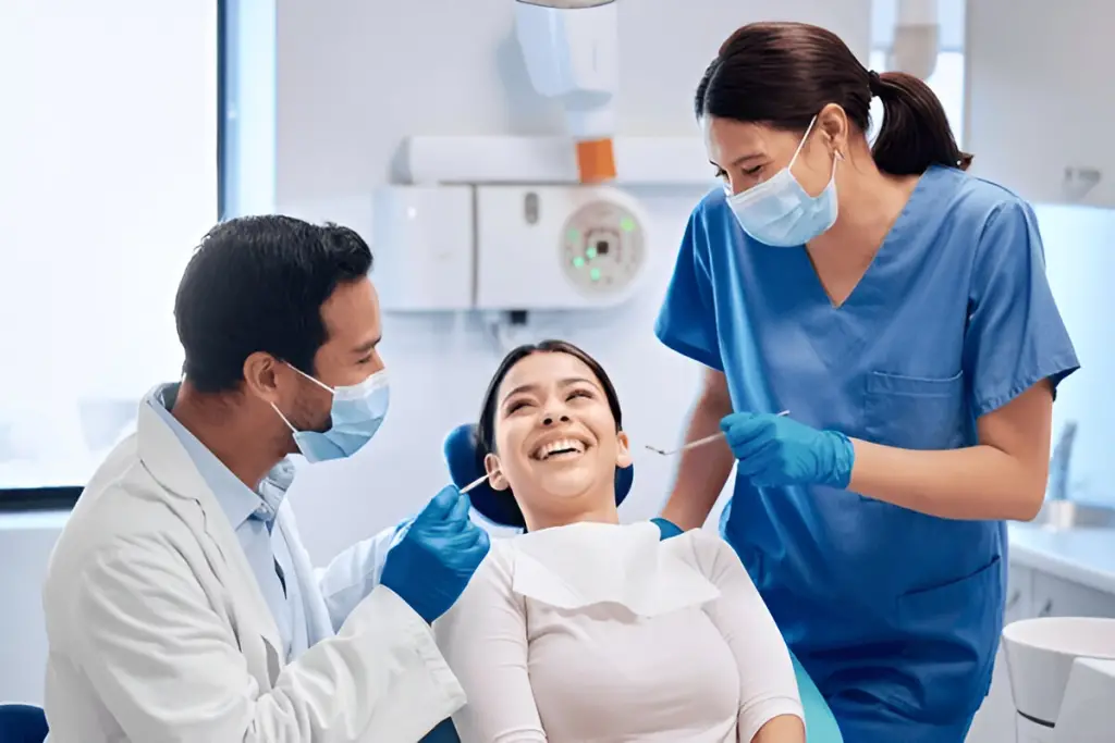 Dentist and assistant with patient.