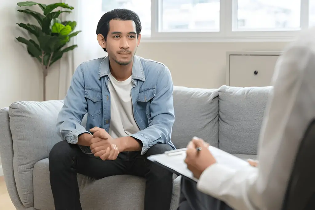 Young man in therapy session.