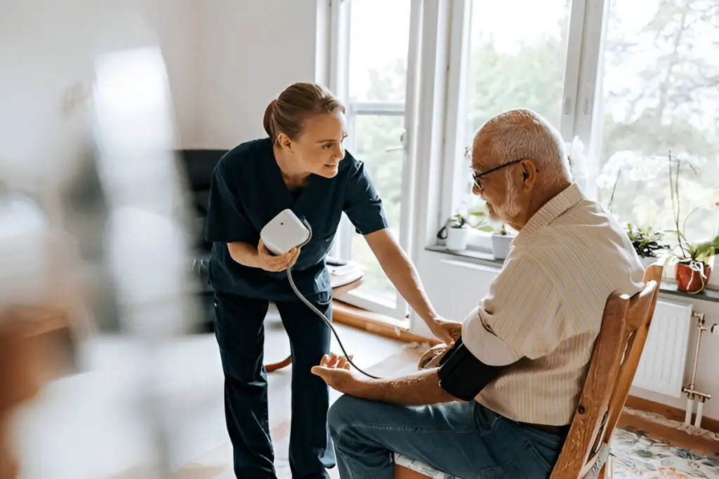 Nurse taking man's blood pressure.