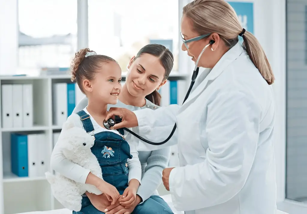Doctor listening to girl's heart.