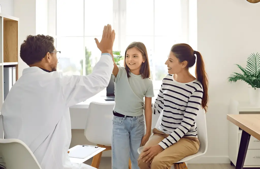 Doctor gives child a high five