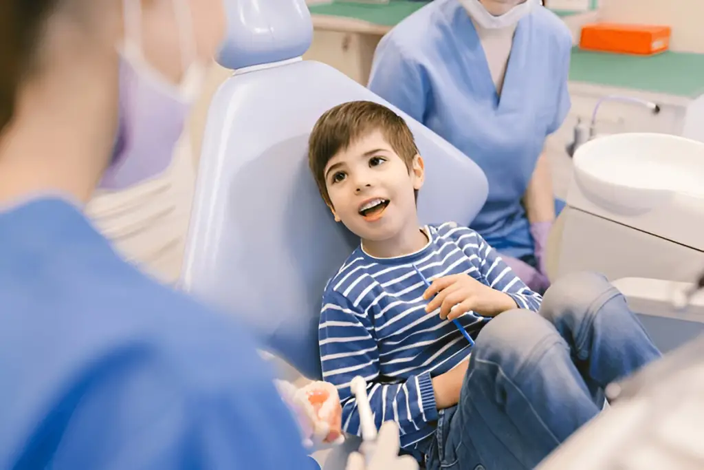 Happy young boy in dentist chair
