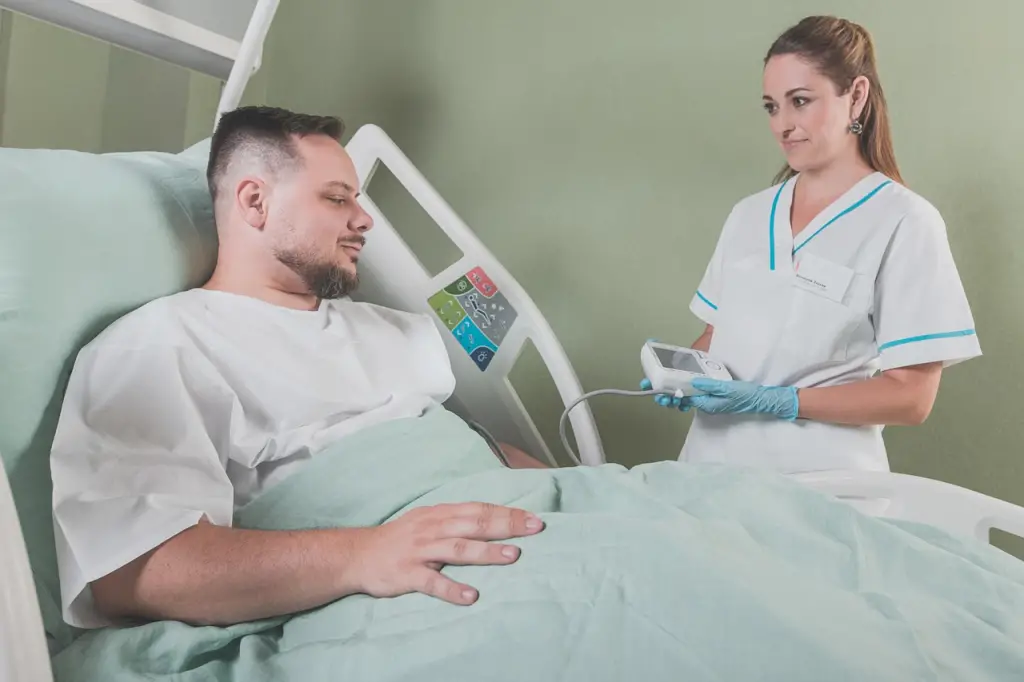 Nurse checks patient's vital signs.