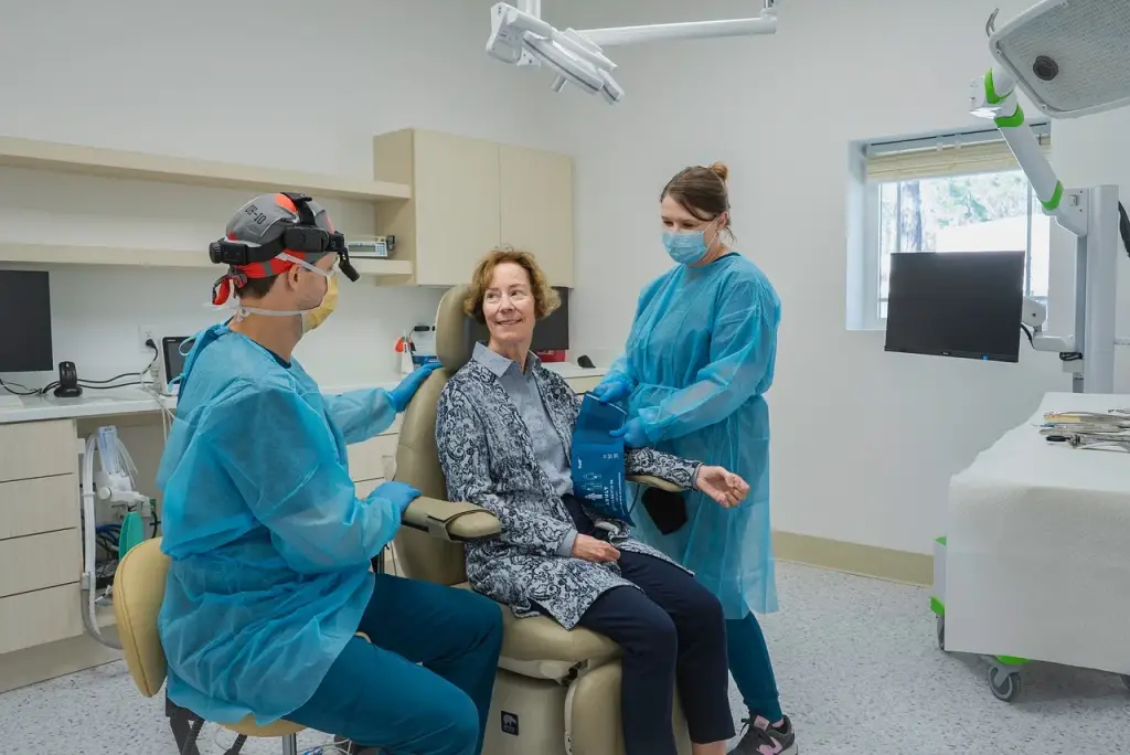 Nurses prepare patient for surgery.