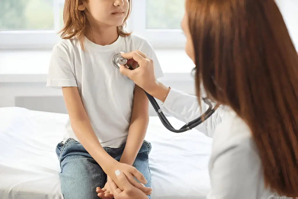 Doctor examining child with stethoscope.