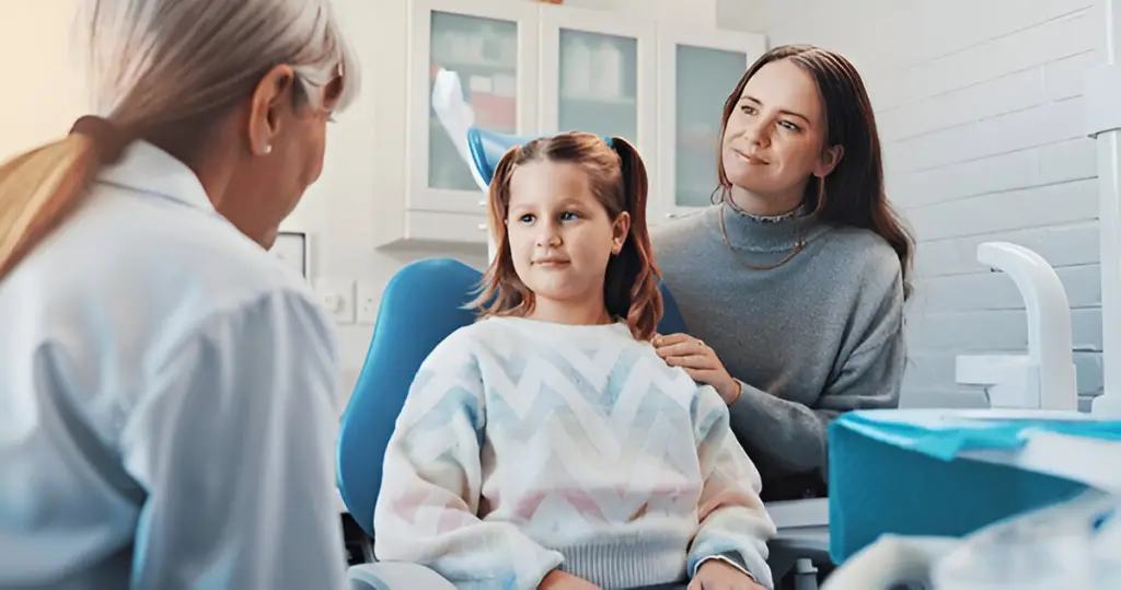 Mother and child at dentist.