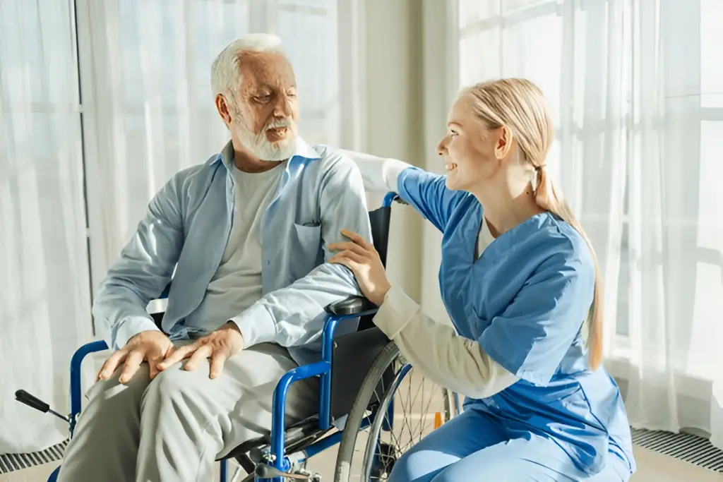 Elderly man and caregiver smiling - Apply for Medicaid in 2026