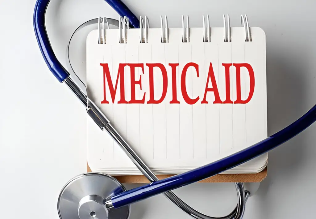 Notepad with "Medicaid" and stethoscope