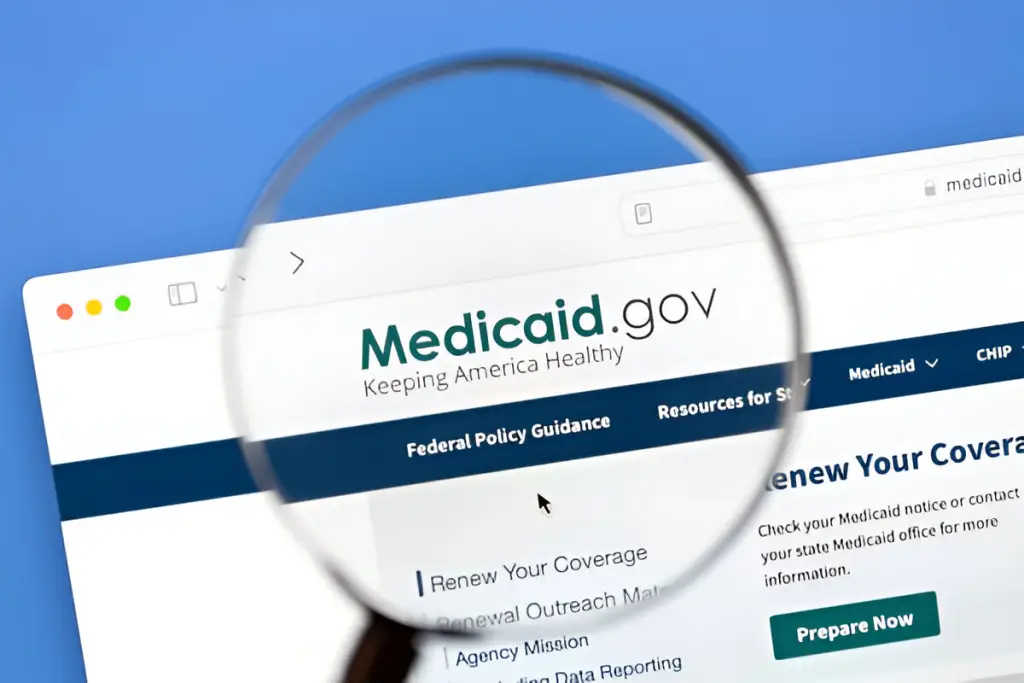 Magnifying glass over Medicaid website