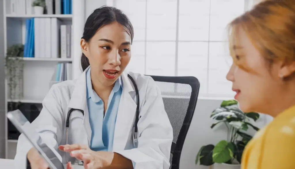 Doctor talking with female patient.